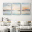 Tríptico decorativo con paisaje marino en tonos suaves azul, crema y naranja-Cuadrostock
