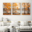 Tríptico decorativo con paisaje otoñal: árboles de hojas anaranjadas reflejados sobre un lago tranquilo.| Cuadrostock