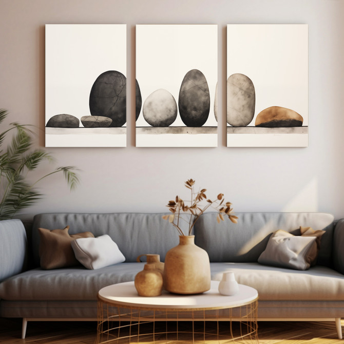 Tríptico minimalista con piedras redondeadas en equilibrio sobre fondo claro. - Cuadrostock